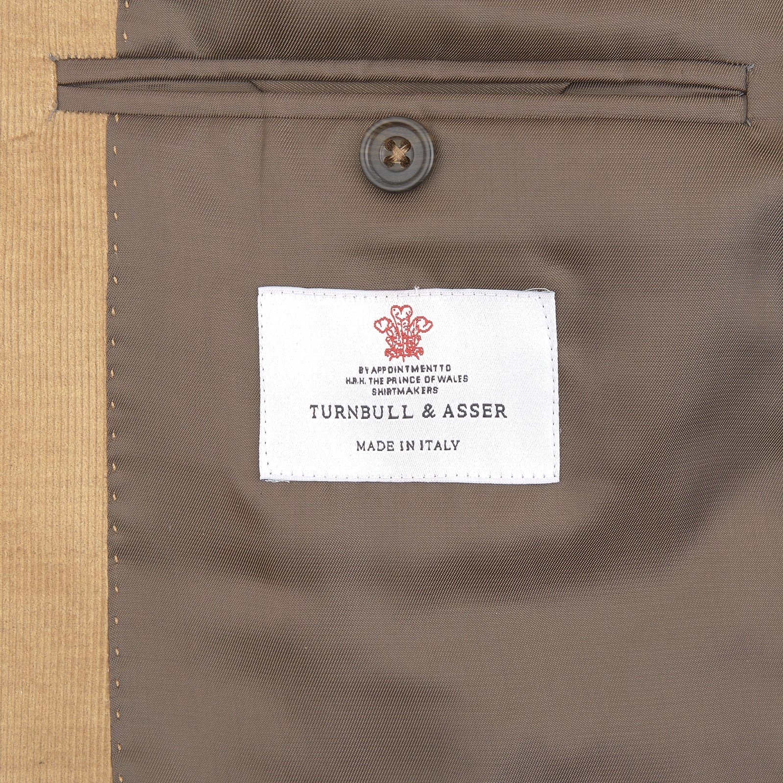 View 2 of product The Turnbull & Asser Camel Cotton Cashmere Corduroy Jacket from the Autumn/Winter collection features notch lapels, a single-breasted button closure, and multiple front pockets. Shown against a plain white background.