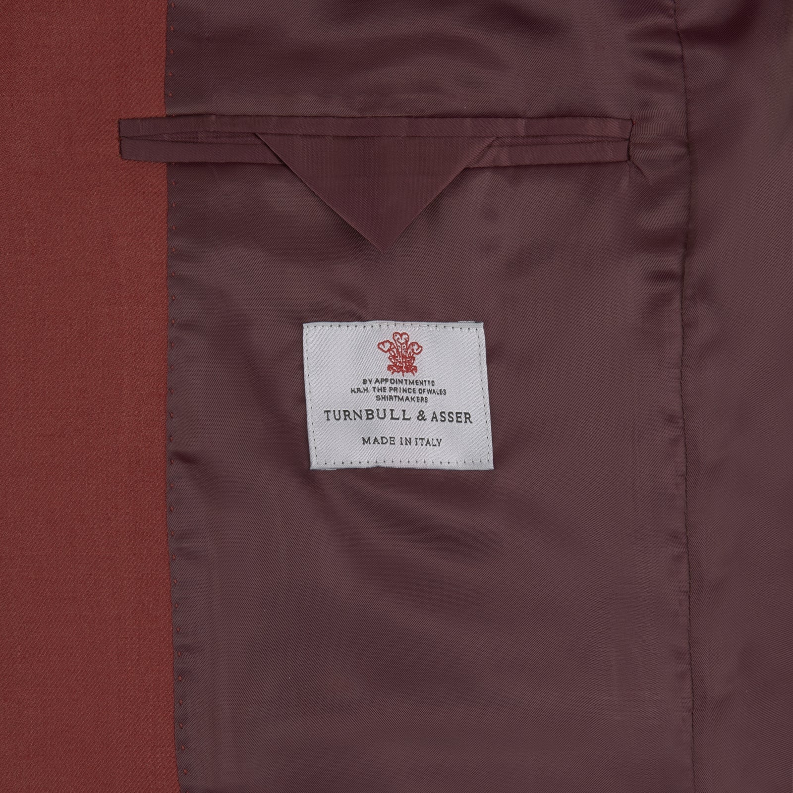View 2 of product The Turnbull & Asser BLZ065-GGAY02 BARRINGTON blazer in red (WO/SI/LI blend) features a single-breasted design, notch lapels, one-button closure, and three front pockets, shown against a plain white background.