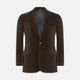 The Turnbull & Asser Brown Velvet Jacket for men features a notched lapel, two buttons, flap pockets, and a chest pocket, shown against a plain white background.