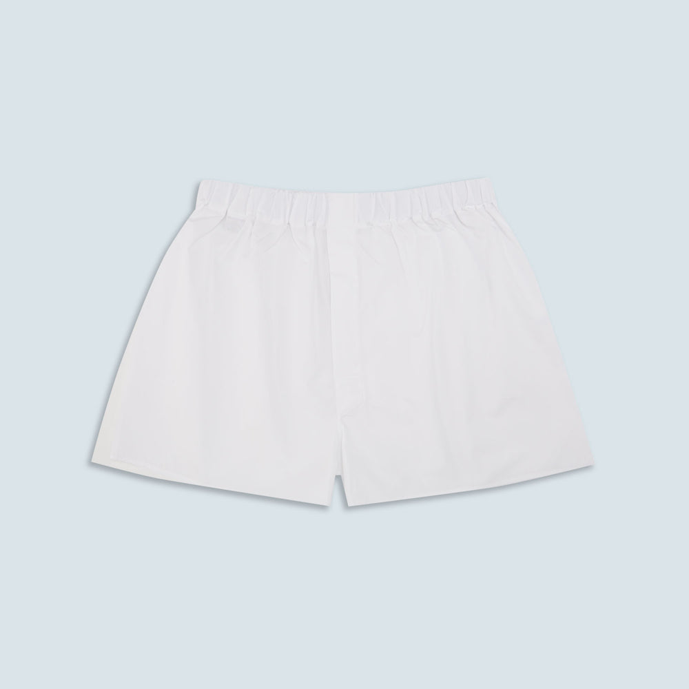 Turnbull & Asser Plain White Cotton Boxer Shorts for men, featuring an elastic waistband and classic, logo-free design, shown on a light blue background.