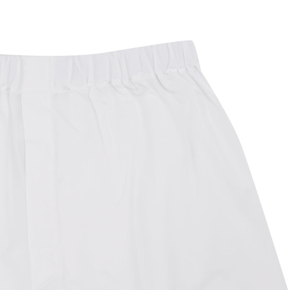 Turnbull & Asser Plain White Cotton Boxer Shorts for men, featuring an elastic waistband and classic, logo-free design, shown on a light blue background.