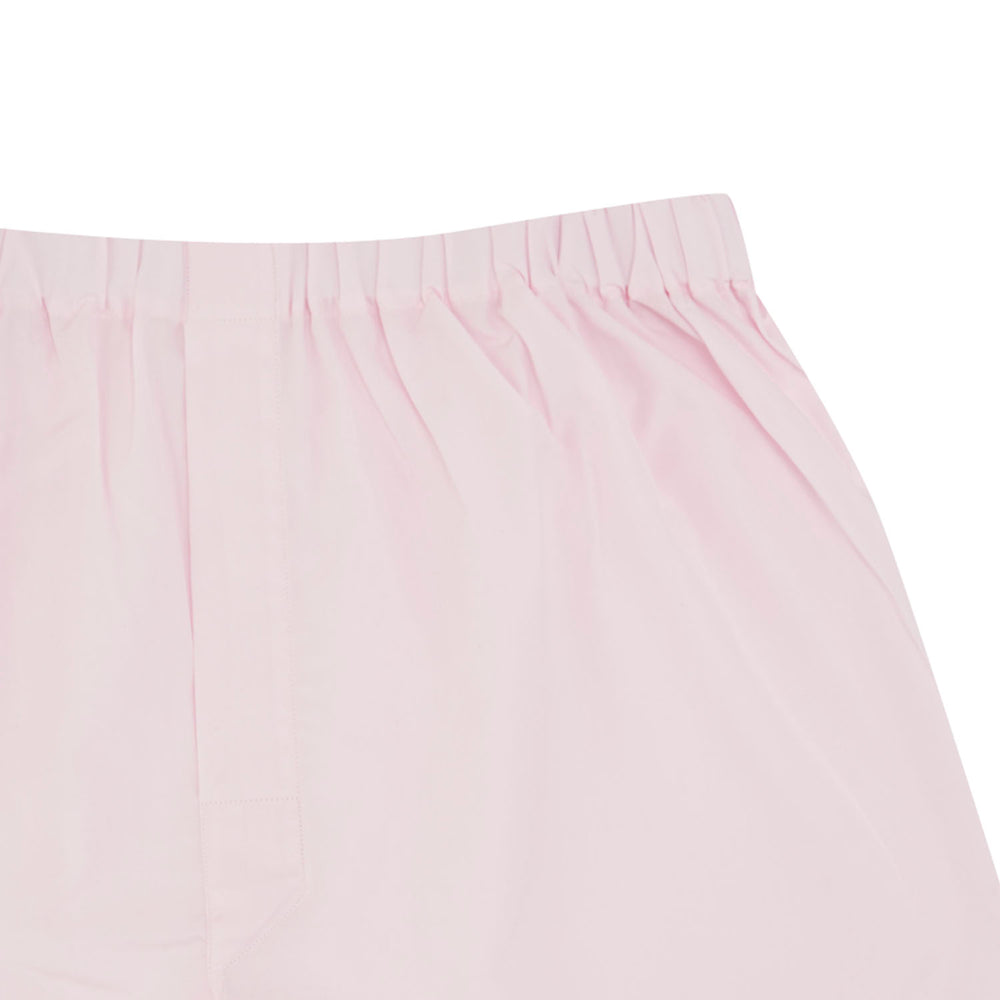 Turnbull & Asser's Plain Pink Cotton Boxer Shorts feature an elastic waistband and are shown flat on a white background—ideal for those seeking classic men's underwear and everyday comfort.