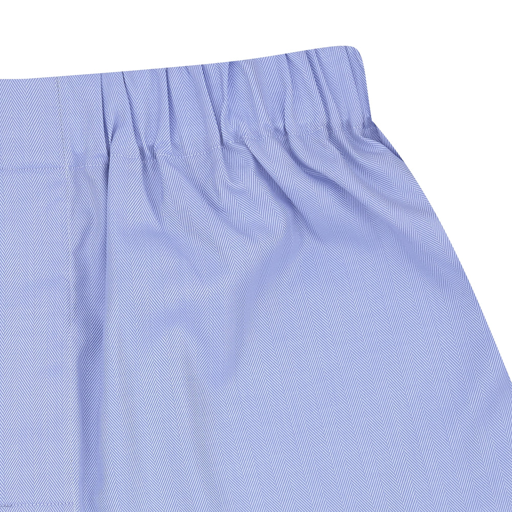 Turnbull & Asser Blue Herringbone Sea Island Quality Cotton Boxer Shorts feature an elastic waistband and are displayed flat on a plain white background.