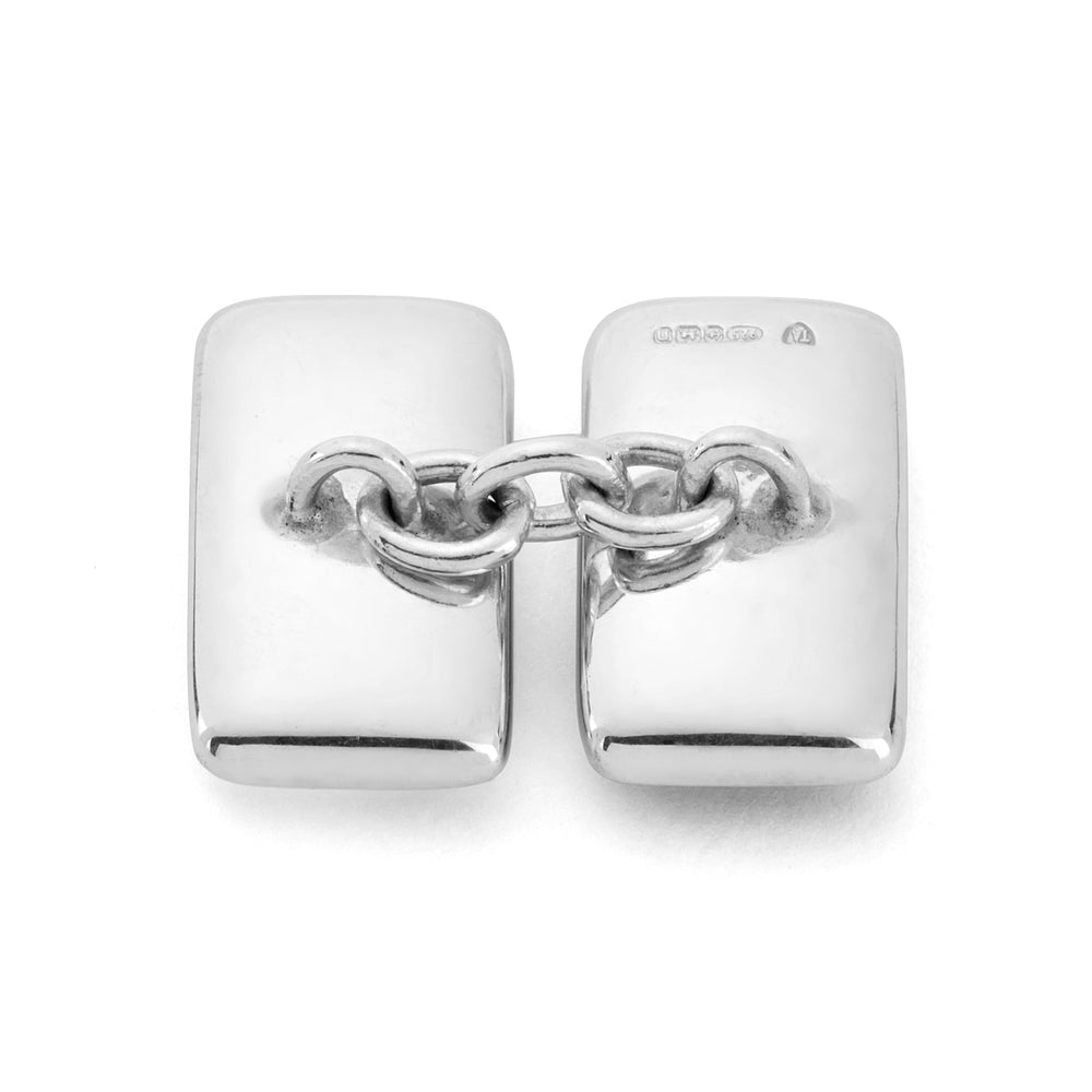 Turnbull & Asser's Reversible Monochrome Sterling Silver Rectangular Cufflinks feature black onyx on one side and white mother-of-pearl on the other, shown against a plain light gray background.