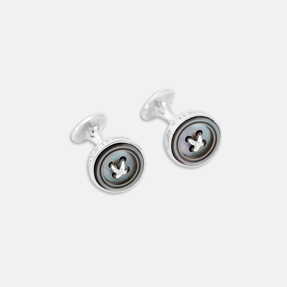 Turnbull & Asser's Smoke Sterling Silver Mother-of-Pearl Button Cufflinks feature a round, button-inspired design with a dark iridescent center and four holes, showcasing British style against a plain white background.