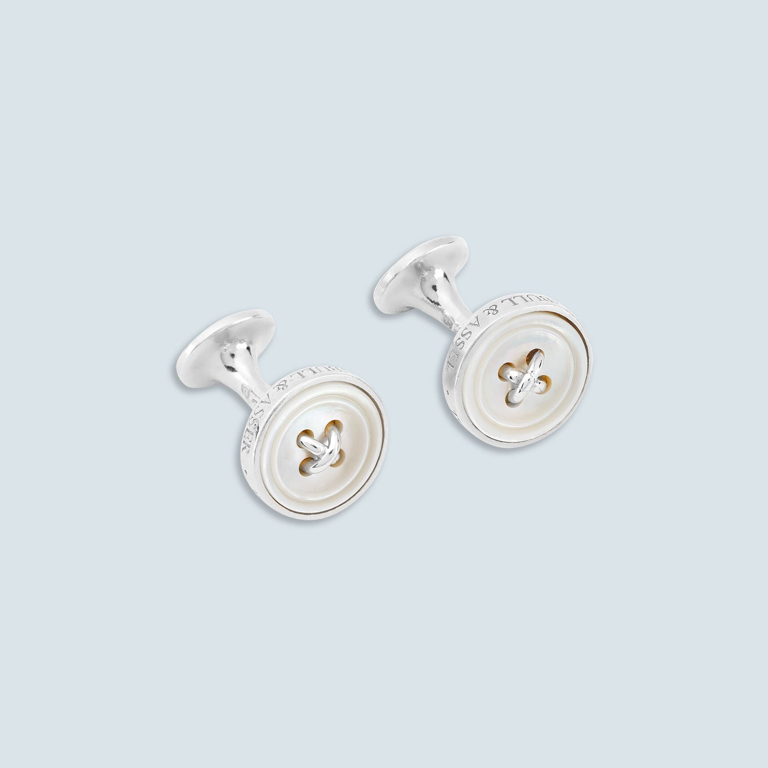 View 1 of product Turnbull & Asser's White Sterling Silver Mother-of-Pearl Button Cufflinks, designed with a four-hole button motif and mother-of-pearl center, are displayed on a light gray background.