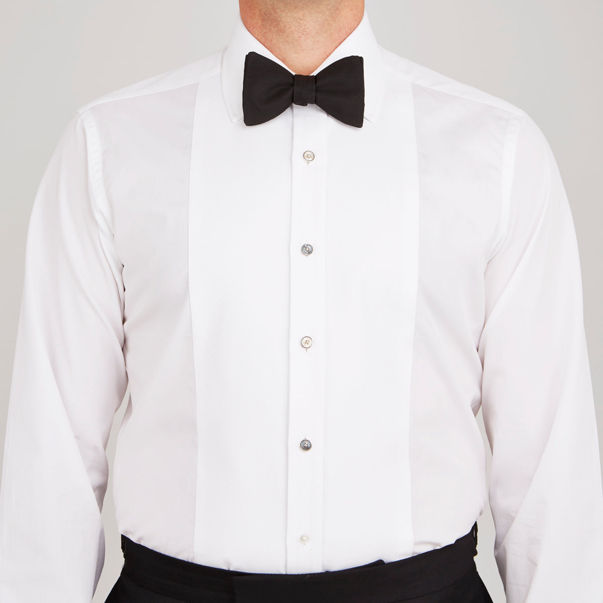 View 2 of product Reversible White and Smoke Mother-of-Pearl Dress Studs by Turnbull & Asser, featuring round faces with light and dark tones—ideal for pairing with onyx cufflinks or silver accessories.