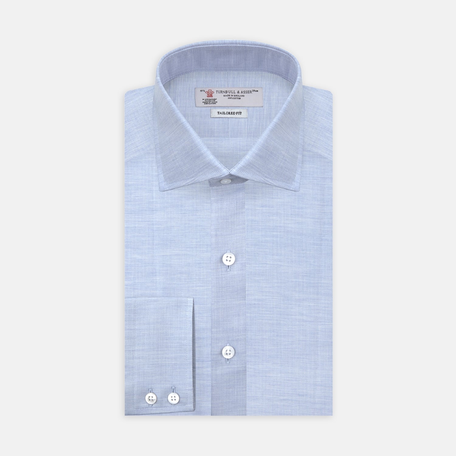 View 1 of product The Turnbull & Asser Esquire Edit Tailored Fit Light Blue Shirt features a Kent collar and 2-button cuffs, neatly folded and displayed on a plain light gray background.