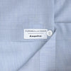 View 2 of product The Turnbull & Asser Esquire Edit Tailored Fit Light Blue Shirt features a Kent collar and 2-button cuffs, neatly folded and displayed on a plain light gray background.