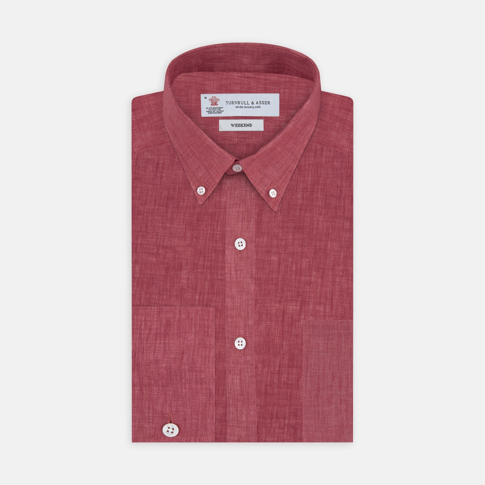 The Turnbull & Asser Weekend Fit Red Linen Shirt features a Dorset collar, 1-button cuff, white buttons, and patch pocket. The long-sleeve shirt is neatly folded and displayed on a plain white background.