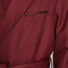 View 5 of product The Turnbull & Asser Burgundy Piped Silk Spot Gown features small white polka dots, a shawl collar, fabric belt, and chest pocket—luxurious nightwear and a stylish men’s statement piece—shown on a white background.