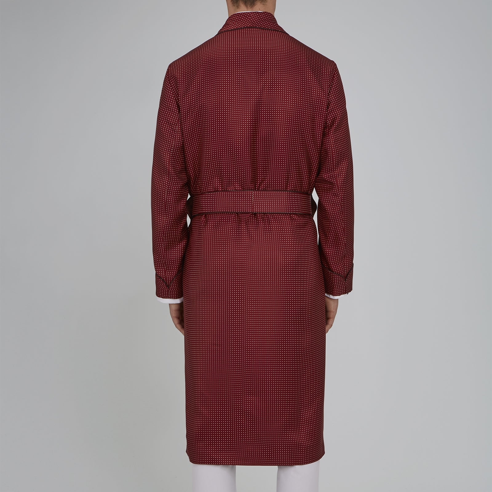 View 3 of product The Turnbull & Asser Burgundy Piped Silk Spot Gown features small white polka dots, a shawl collar, fabric belt, and chest pocket—luxurious nightwear and a stylish men’s statement piece—shown on a white background.