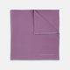 The Lilac and White Piped Silk Pocket Square by Turnbull & Asser features a smooth lilac silk fabric with a refined white piped edge and the brand's signature printed in white on the lower right corner.
