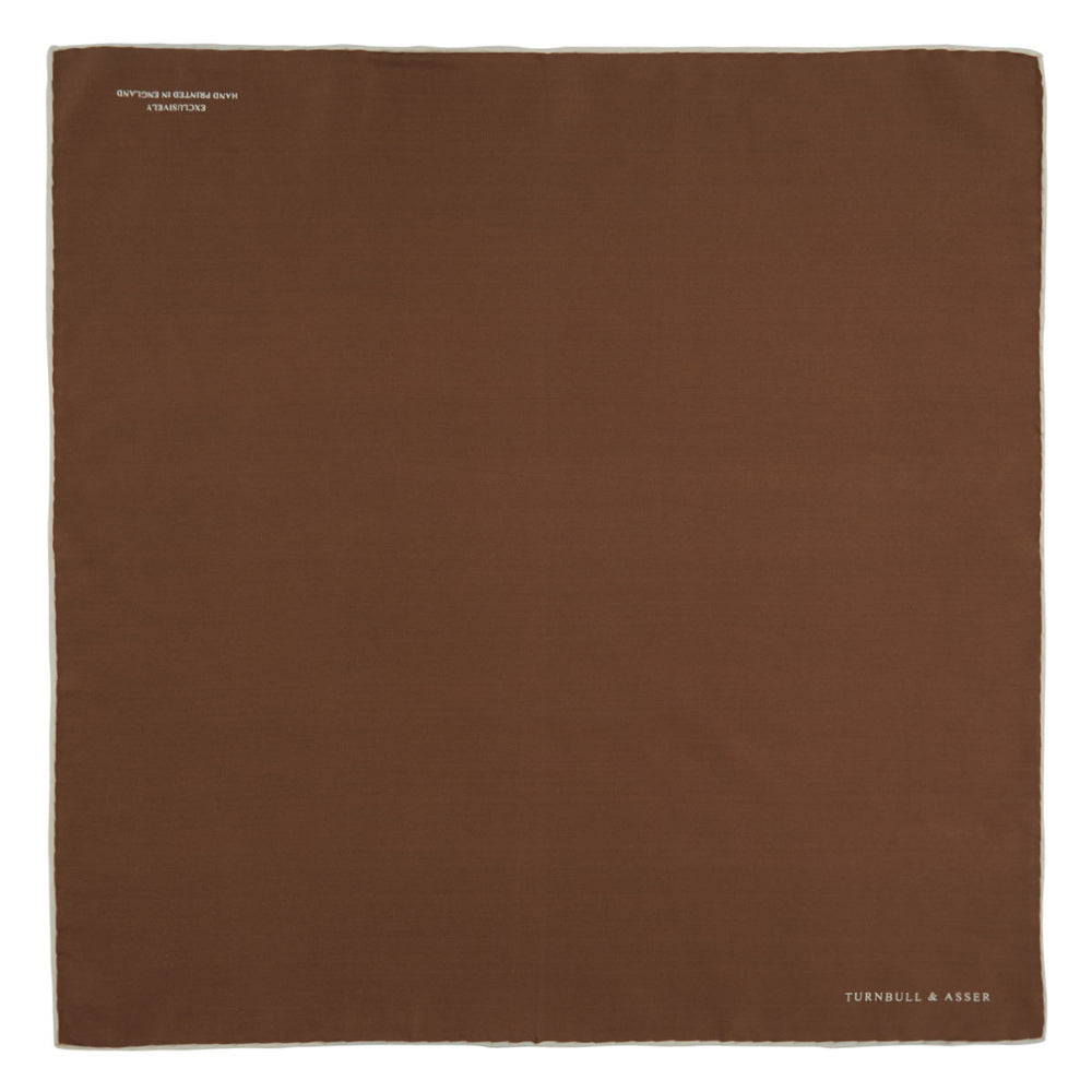 The Brown and White Piped Silk Pocket Square by Turnbull & Asser features a stitched edge and discreet branding—an elegant accessory for any occasion.