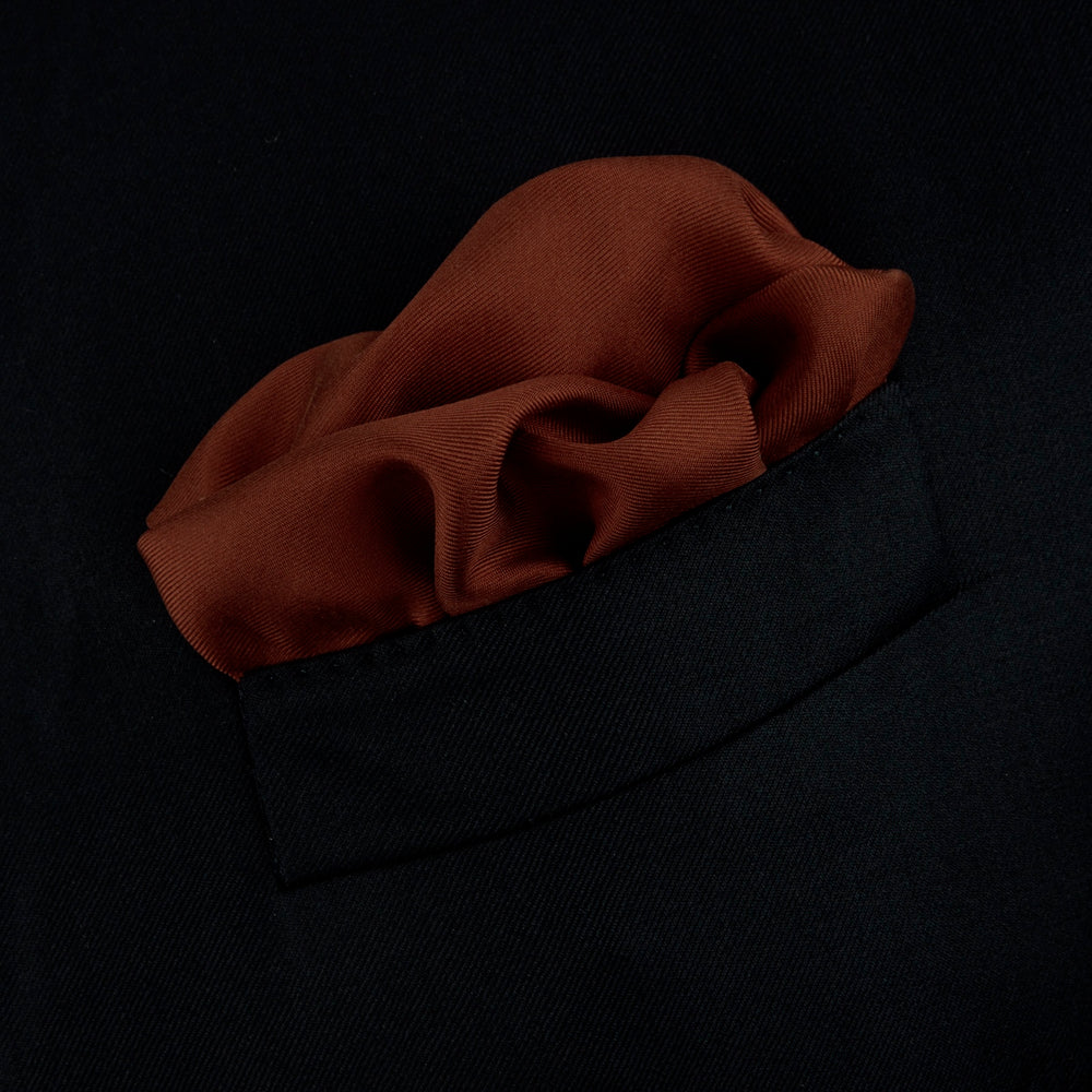 The Brown and White Piped Silk Pocket Square by Turnbull & Asser features a stitched edge and discreet branding—an elegant accessory for any occasion.