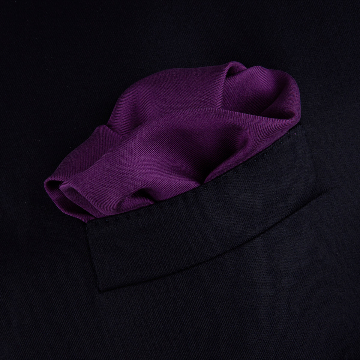 View 3 of product This elegant Plain Purple Silk Pocket Square with White piping by Turnbull & Asser is the perfect suit accessory for the discerning gentleman.