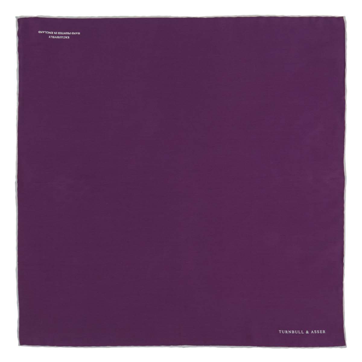 View 2 of product This elegant Plain Purple Silk Pocket Square with White piping by Turnbull & Asser is the perfect suit accessory for the discerning gentleman.