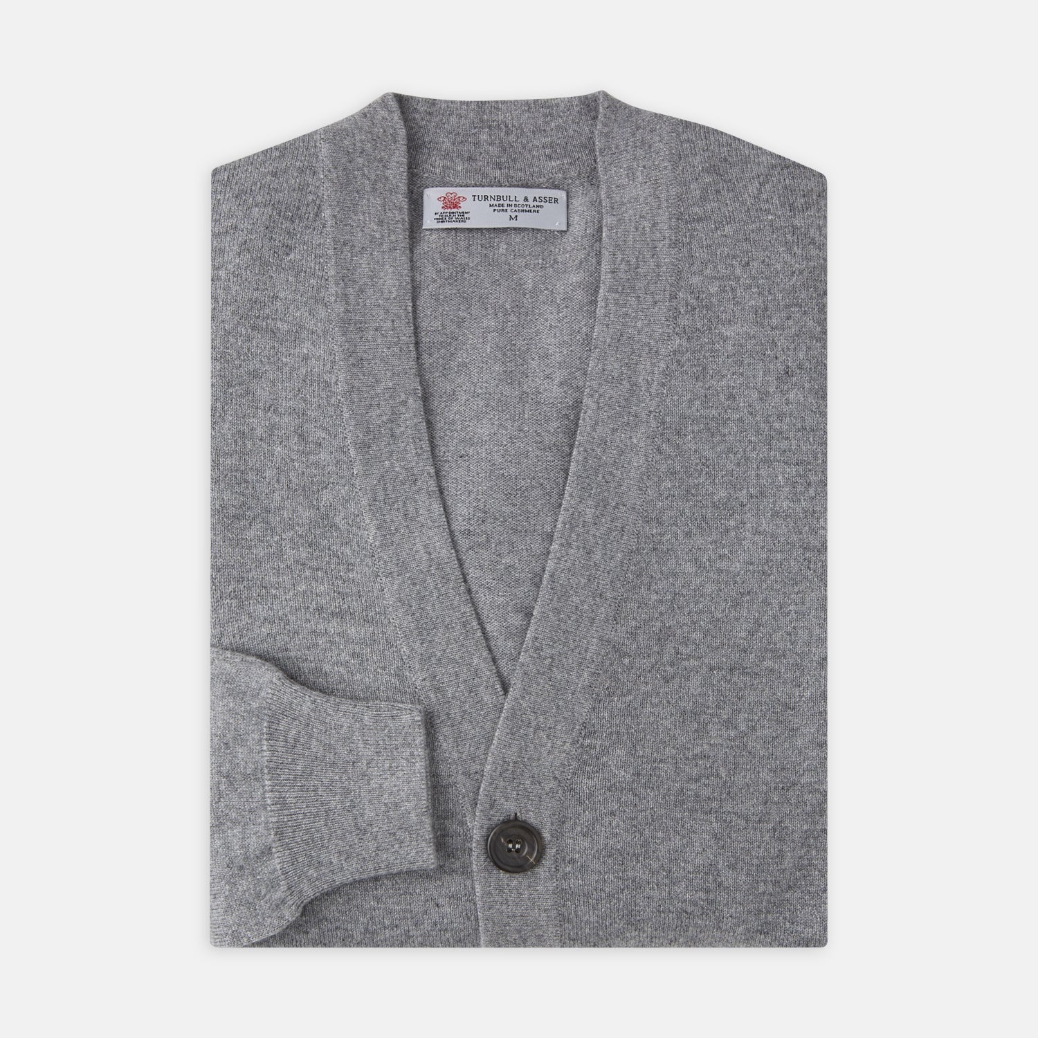 View 4 of product The Grey Fine Cashmere Cardigan by Turnbull & Asser is a long-sleeve, button-up sweater with two front pockets, shown on a white background.