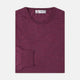The Plum Fine Merino Crew Neck Jumper by Turnbull & Asser features classic Scottish knitwear craftsmanship in a rich maroon shade, shown neatly folded with long sleeves against a plain white background.