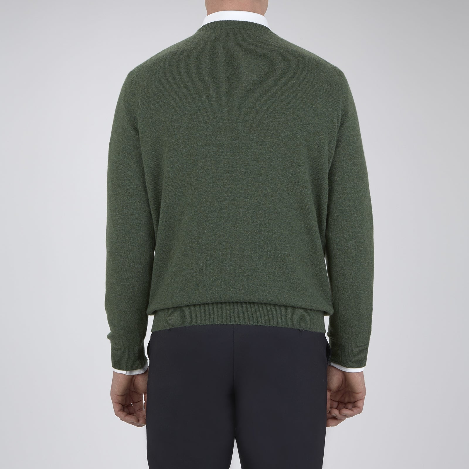 View 3 of product The Turnbull & Asser Green Crew Neck Cashmere Jumper, crafted from luxurious Scottish cashmere with ribbed cuffs, is neatly folded and displayed on a plain white background with the brand label visible inside the neckline.