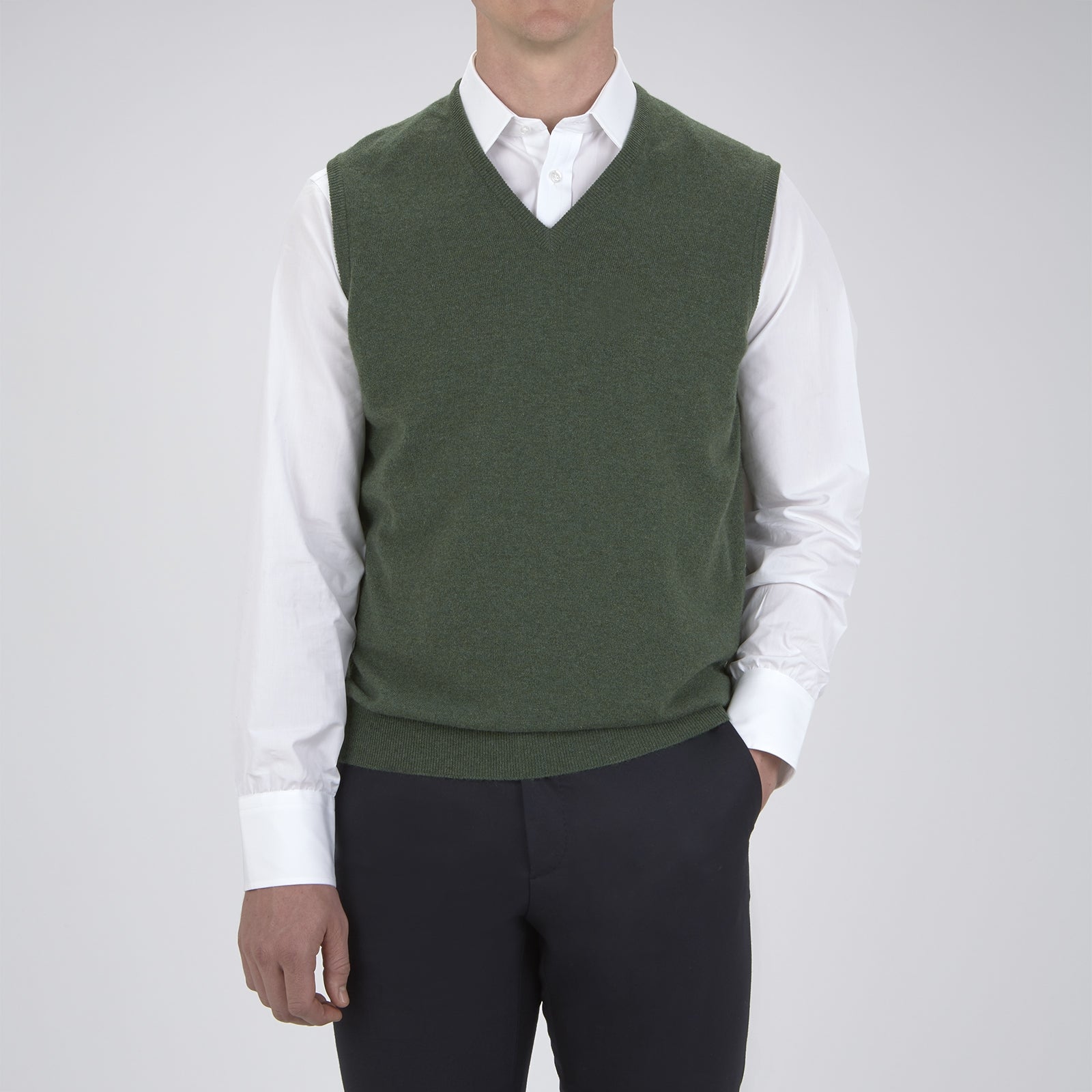 View 2 of product The Turnbull & Asser Green V-Neck Cashmere Slipover is neatly folded with the brand and size tag visible, displayed flat on a plain white background.