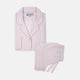 The Turnbull & Asser Ladies' Pink Cotton-Cashmere Pyjama Set features a collared, button-up top with a pocket and matching drawstring pants, both detailed with subtle piping, displayed on a plain white background.