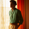 View 2 of product The Turnbull & Asser Teal Weekend Fit Long Sleeve Linen Shirt features a stand collar, 1-button cuffs, white buttons, and a relaxed fit, shown on a plain white background.
