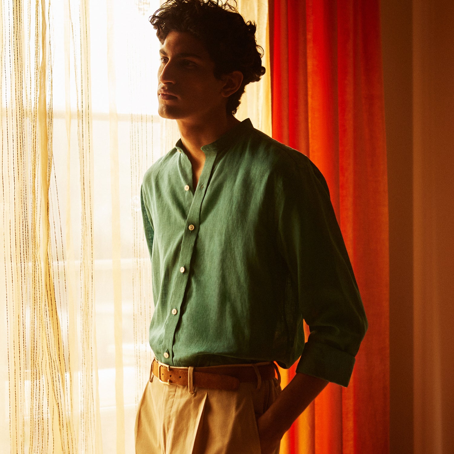 View 2 of product The Turnbull & Asser Teal Weekend Fit Long Sleeve Linen Shirt features a stand collar, 1-button cuffs, white buttons, and a relaxed fit, shown on a plain white background.