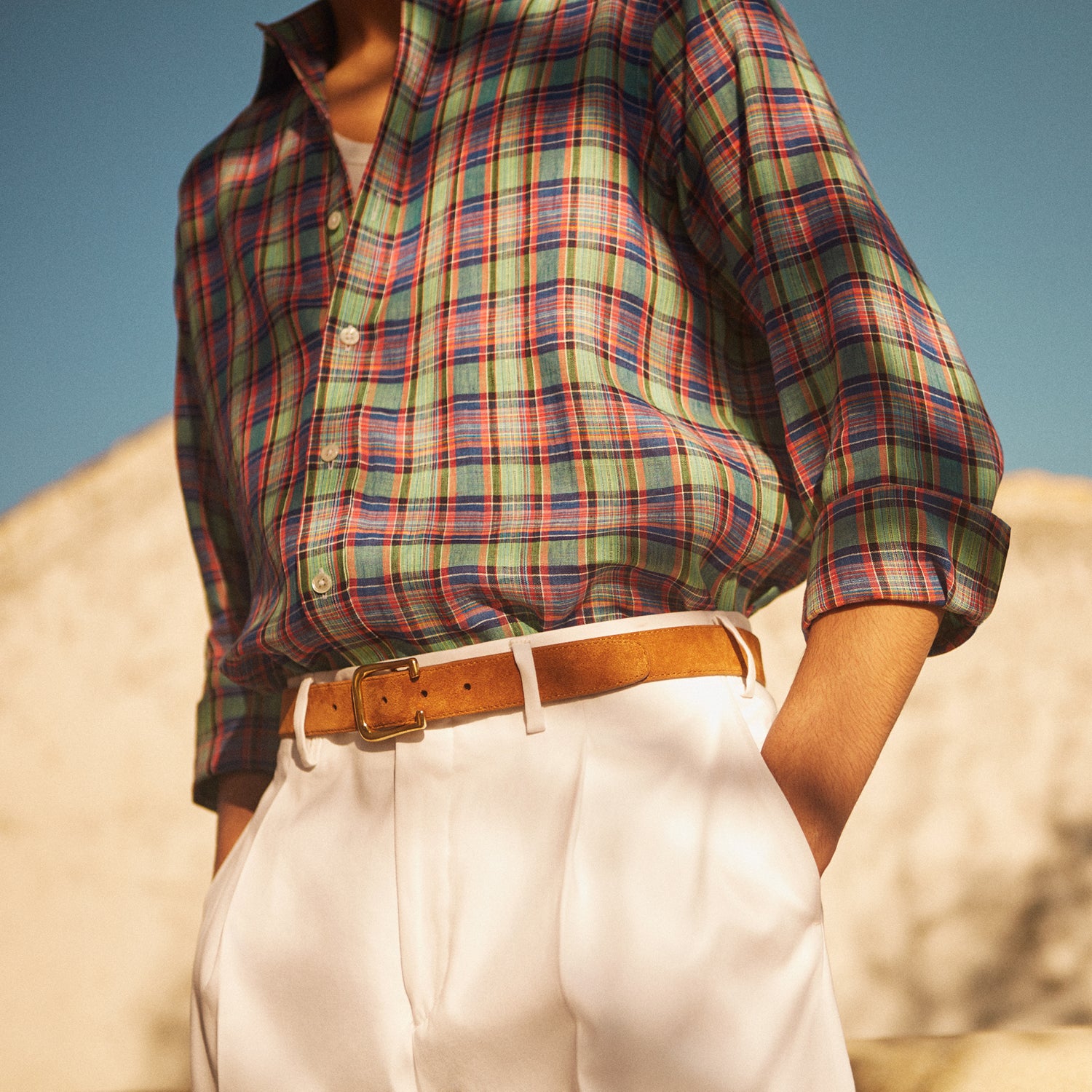 View 2 of product Turnbull & Asser’s White Cotton Pleated Trousers, a summer classic, are elegantly displayed against a crisp white backdrop.
