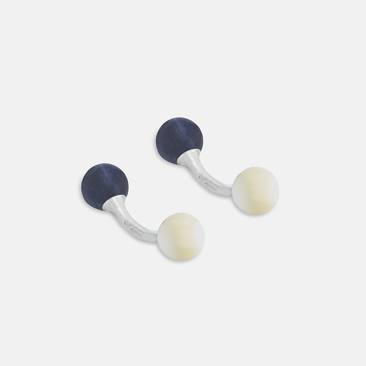 View 1 of product Turnbull & Asser Reversible Navy and White Bulb Sterling Silver Cufflinks feature curved silver stems with one navy and one mother-of-pearl round end per cufflink—an elegant black tie accessory, shown on a plain white background.