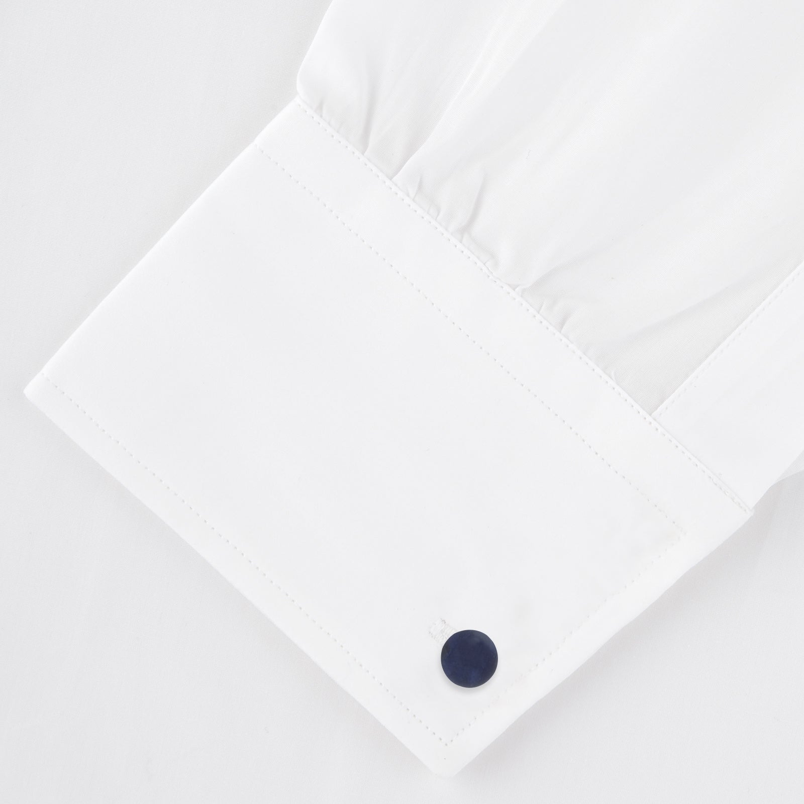 View 4 of product Turnbull & Asser Reversible Navy and White Bulb Sterling Silver Cufflinks feature curved silver stems with one navy and one mother-of-pearl round end per cufflink—an elegant black tie accessory, shown on a plain white background.