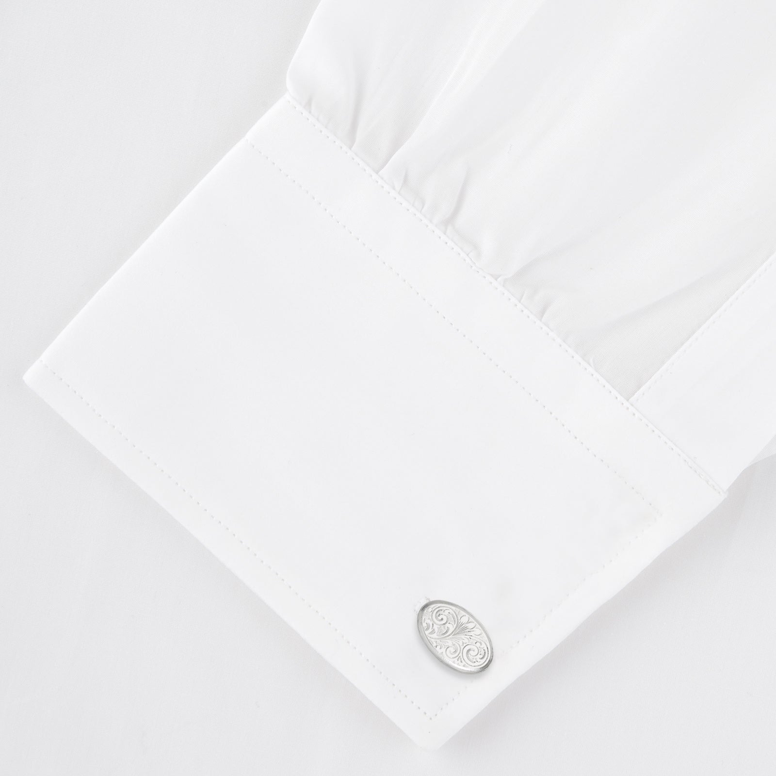 View 4 of product The Turnbull & Asser STERLING SILVER ART CUFFLINKS have oval faces with an engraved swirl pattern, finished elegantly against a plain white background.