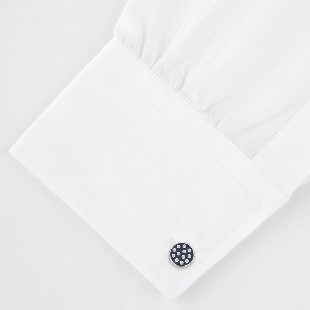 The Spotted Navy and White Sterling Silver Enamelled Cufflinks by Turnbull & Asser feature a navy enamel face with evenly spaced silver dots, making them a smart finishing touch for any outfit.