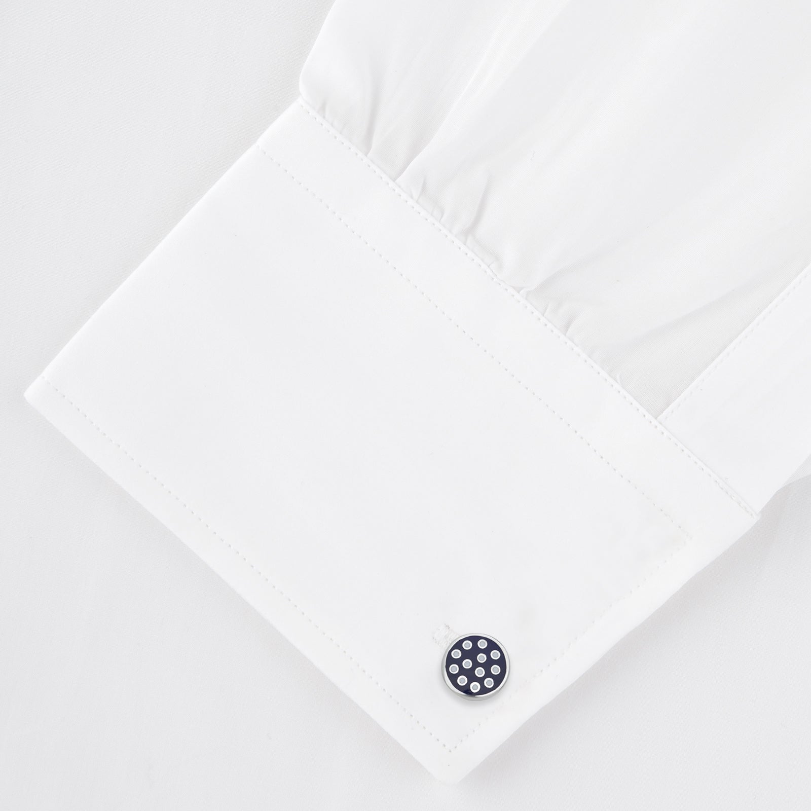 View 4 of product The Spotted Navy and White Sterling Silver Enamelled Cufflinks by Turnbull & Asser feature a navy enamel face with evenly spaced silver dots, making them a smart finishing touch for any outfit.