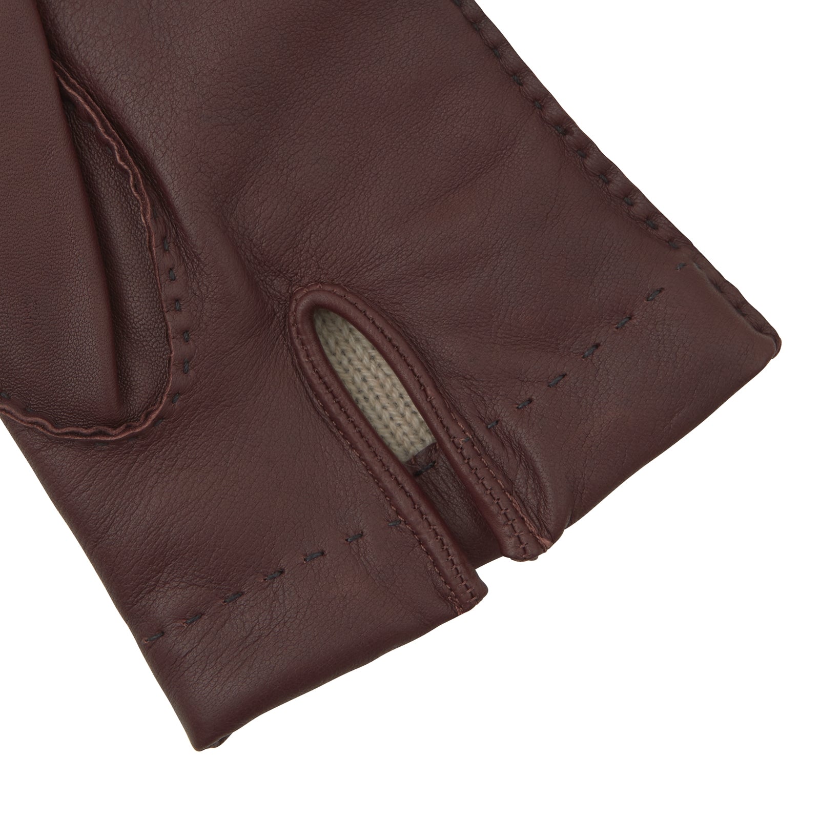 View 2 of product Turnbull & Asser’s Brown Hairsheep Leather Gloves, featuring visible stitching and decorative raised seams on the back, are displayed overlapping each other against a white background.