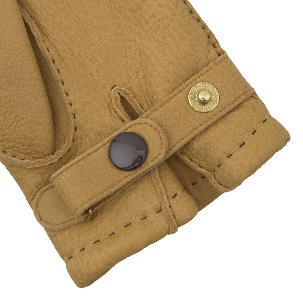 Turnbull & Asser Camel Deerskin Leather Gloves feature visible stitching and decorative lines on the back, shown against a white background to highlight their timeless casual style.