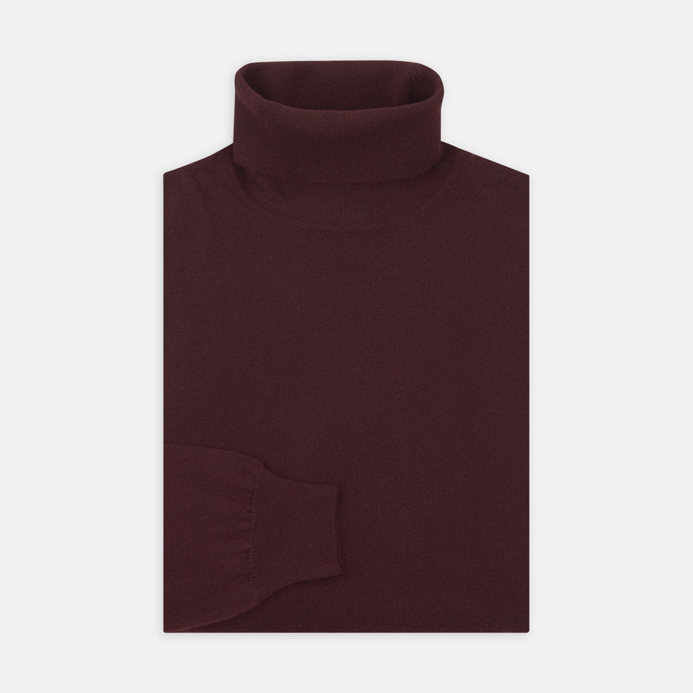 A folded, long-sleeve Port Cashmere Roll Neck Jumper by Turnbull & Asser in burgundy is displayed on a white background, highlighting this stylish men's autumn piece.