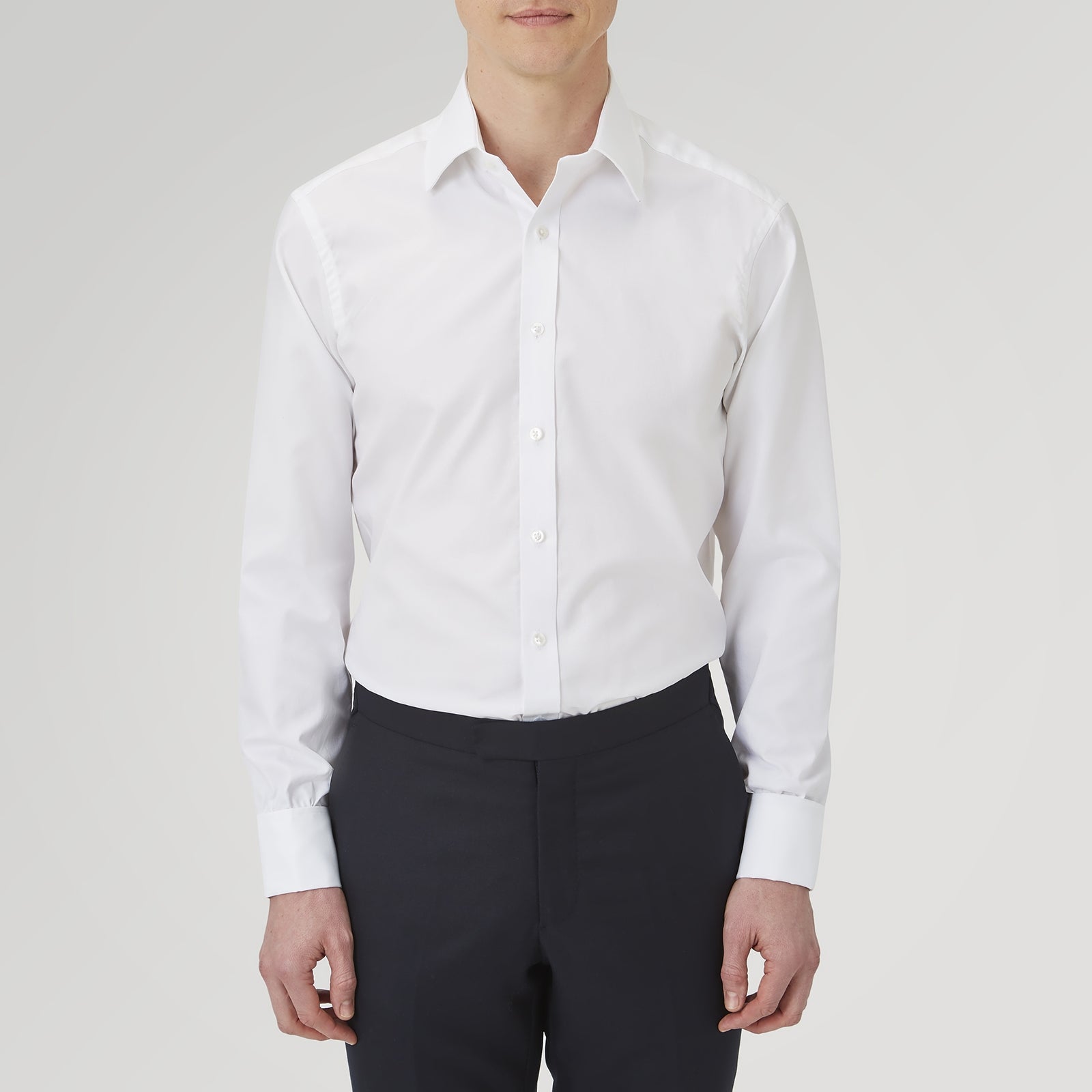 View 2 of product The Turnbull & Asser White Superfine Oxford Cotton Shirt features a T&A collar, double cuffs, and a left chest pocket. Displayed on a light gray background, it includes a visible label inside the collar—ideal for smart evening wear.