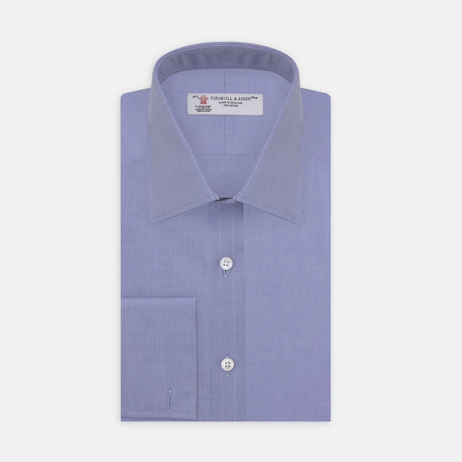 View 1 of product A Pink Superfine Oxford Cotton Shirt by Turnbull & Asser, featuring a T&A collar, double cuffs, and white buttons, is neatly folded and displayed against a plain white background.