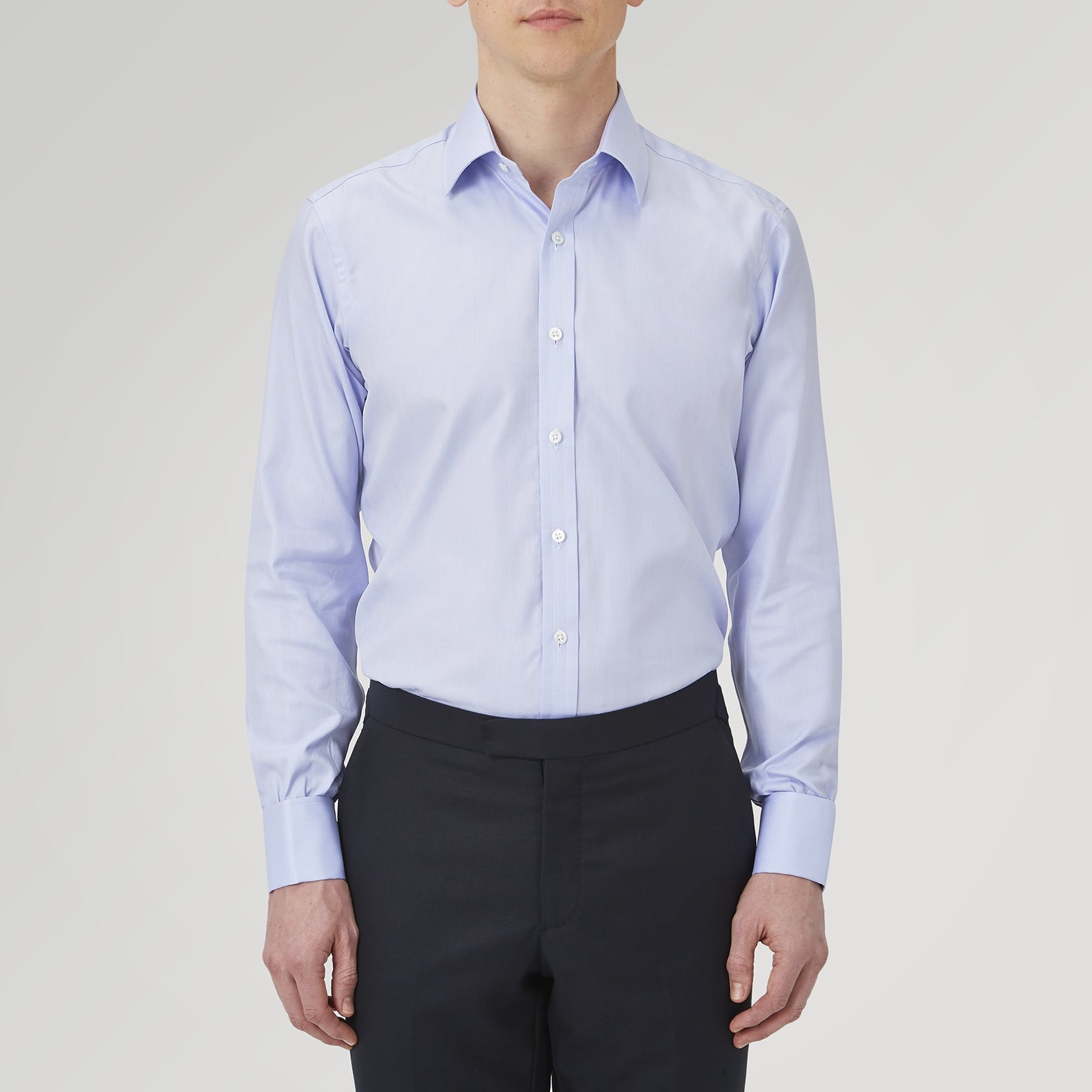 View 2 of product A Turnbull & Asser Light Blue Herringbone Sea Island Quality Cotton Shirt with T&A collar and double cuffs is neatly folded, label visible, and displayed against a plain white background.