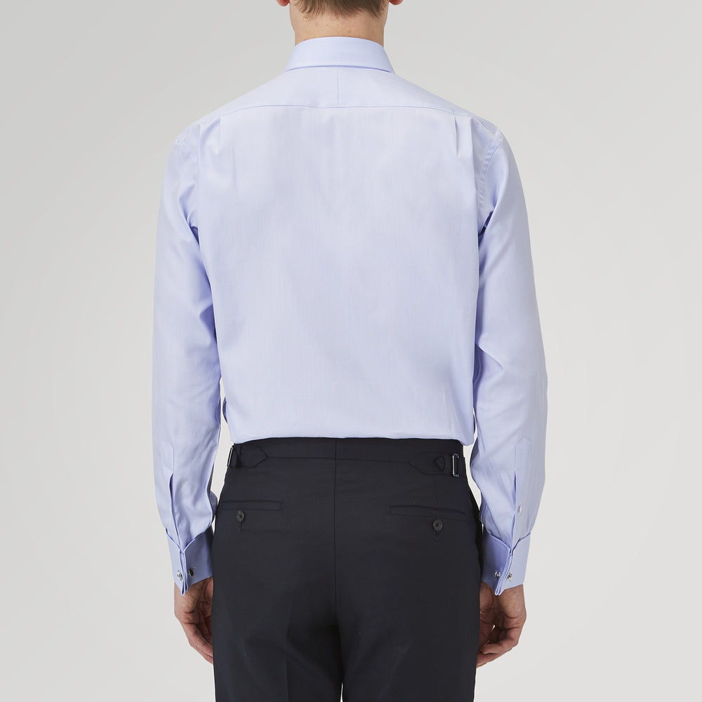 A Turnbull & Asser Light Blue Herringbone Sea Island Quality Cotton Shirt with T&A collar and double cuffs is neatly folded, label visible, and displayed against a plain white background.