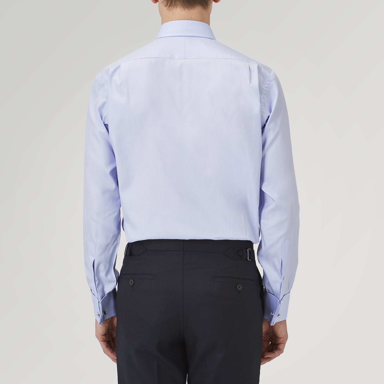 View 3 of product A Turnbull & Asser Light Blue Herringbone Sea Island Quality Cotton Shirt with T&A collar and double cuffs is neatly folded, label visible, and displayed against a plain white background.