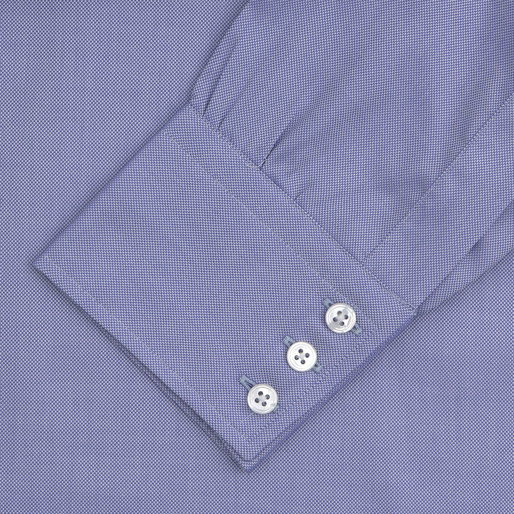 A Blue Superfine Oxford Cotton Shirt by Turnbull & Asser, featuring a T&A collar and 3-button cuffs, is displayed against a plain white background.