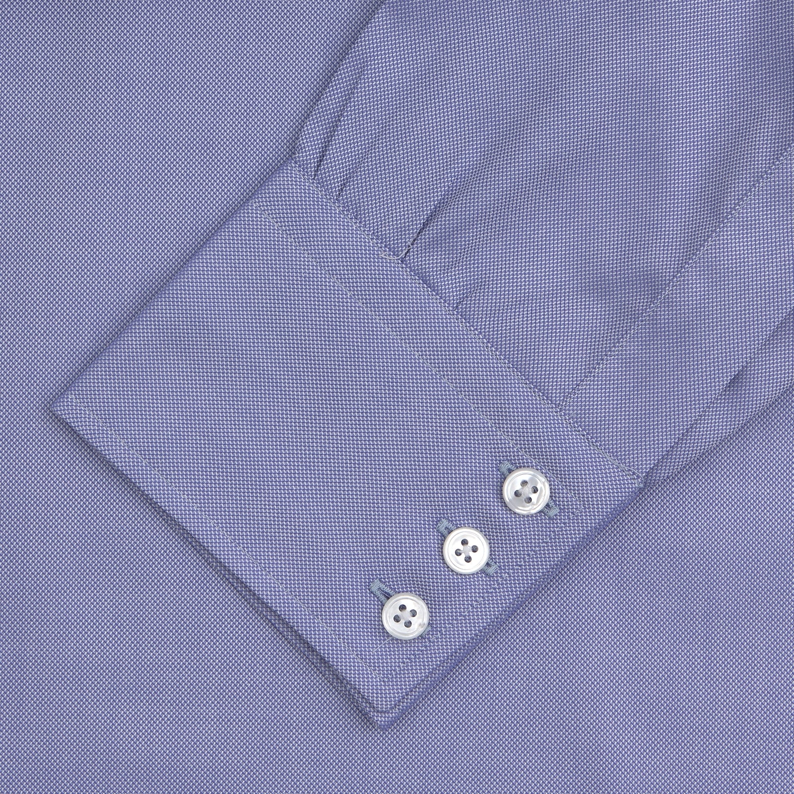 View 4 of product A Blue Superfine Oxford Cotton Shirt by Turnbull & Asser, featuring a T&A collar and 3-button cuffs, is displayed against a plain white background.