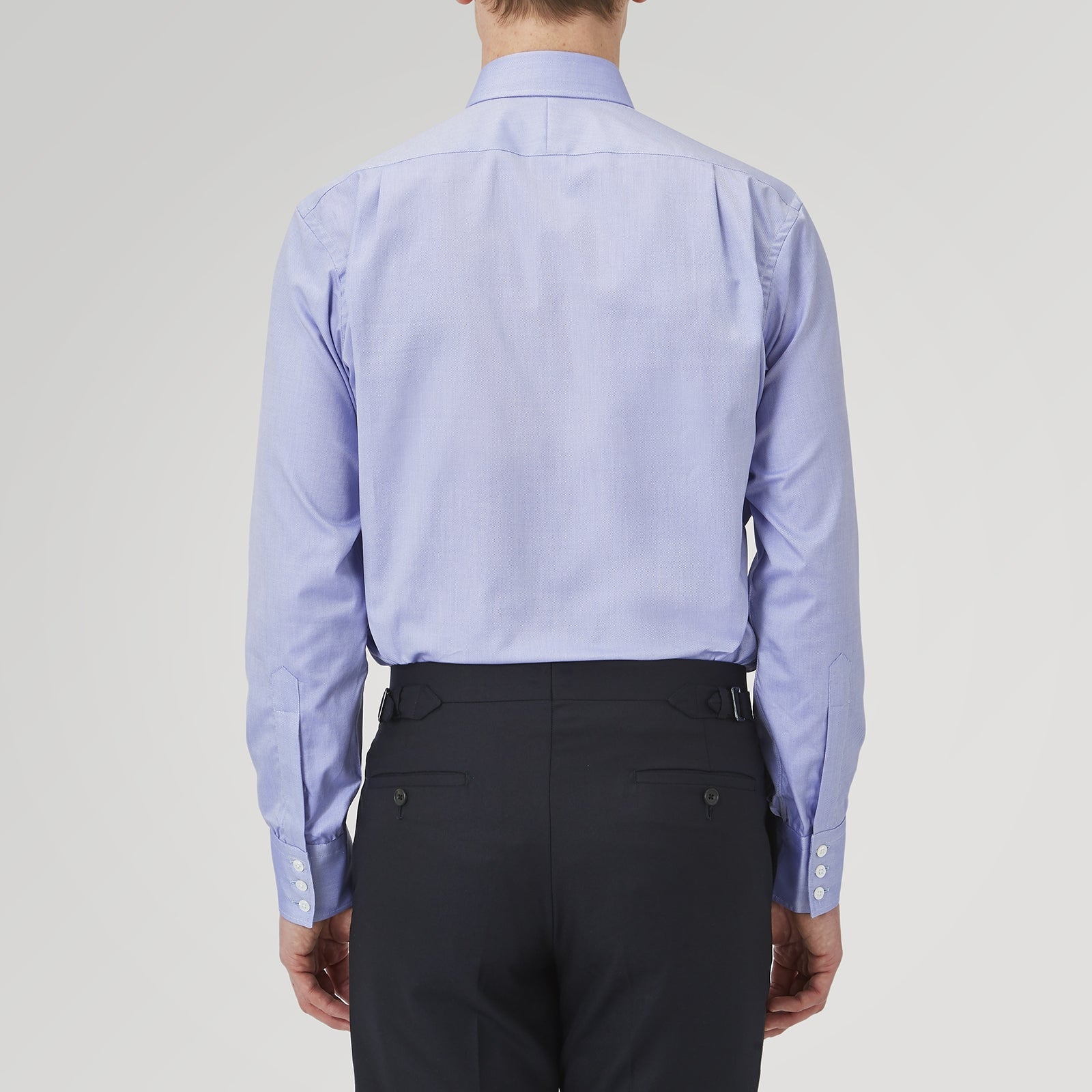 View 3 of product A Blue Superfine Oxford Cotton Shirt by Turnbull & Asser, featuring a T&A collar and 3-button cuffs, is displayed against a plain white background.