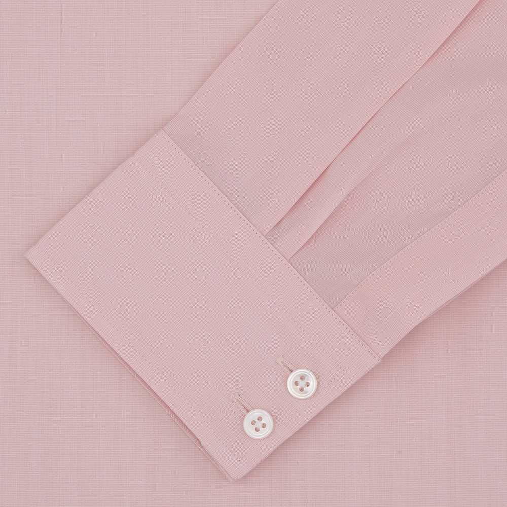 A neatly folded dark blue end-on-end Turnbull & Asser shirt with a T&A collar and 3-button cuffs, displayed against a plain white background. The label inside the collar is visible.