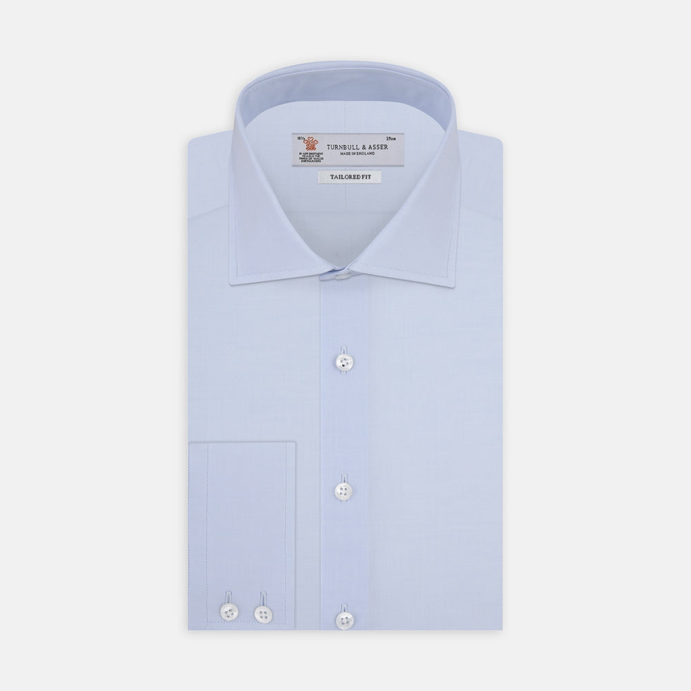 Turnbull & Asser's Tailored Fit Two-Fold 120 Light Blue Shirt features a classic Kent collar, white buttons, long sleeves with 2-button cuffs, and an inner collar label.