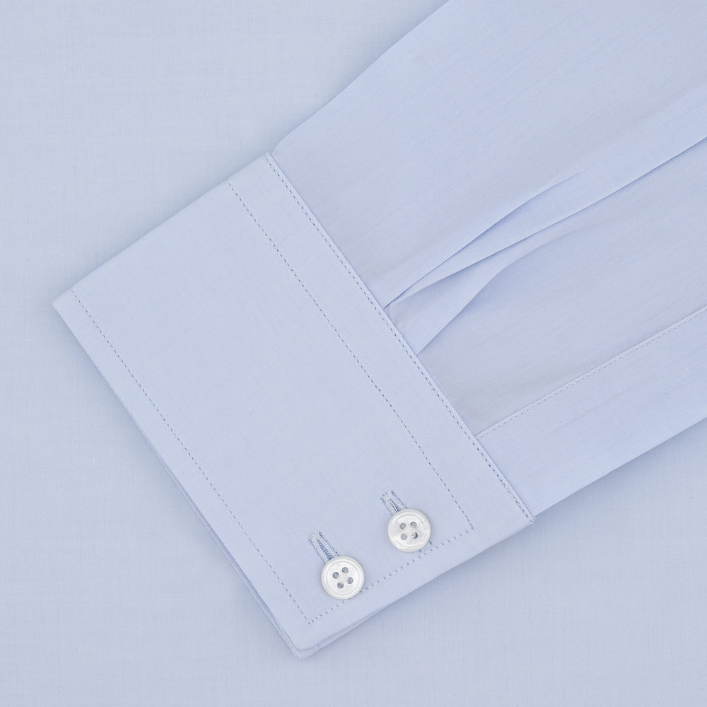 Turnbull & Asser's Tailored Fit Two-Fold 120 Light Blue Shirt features a classic Kent collar, white buttons, long sleeves with 2-button cuffs, and an inner collar label.