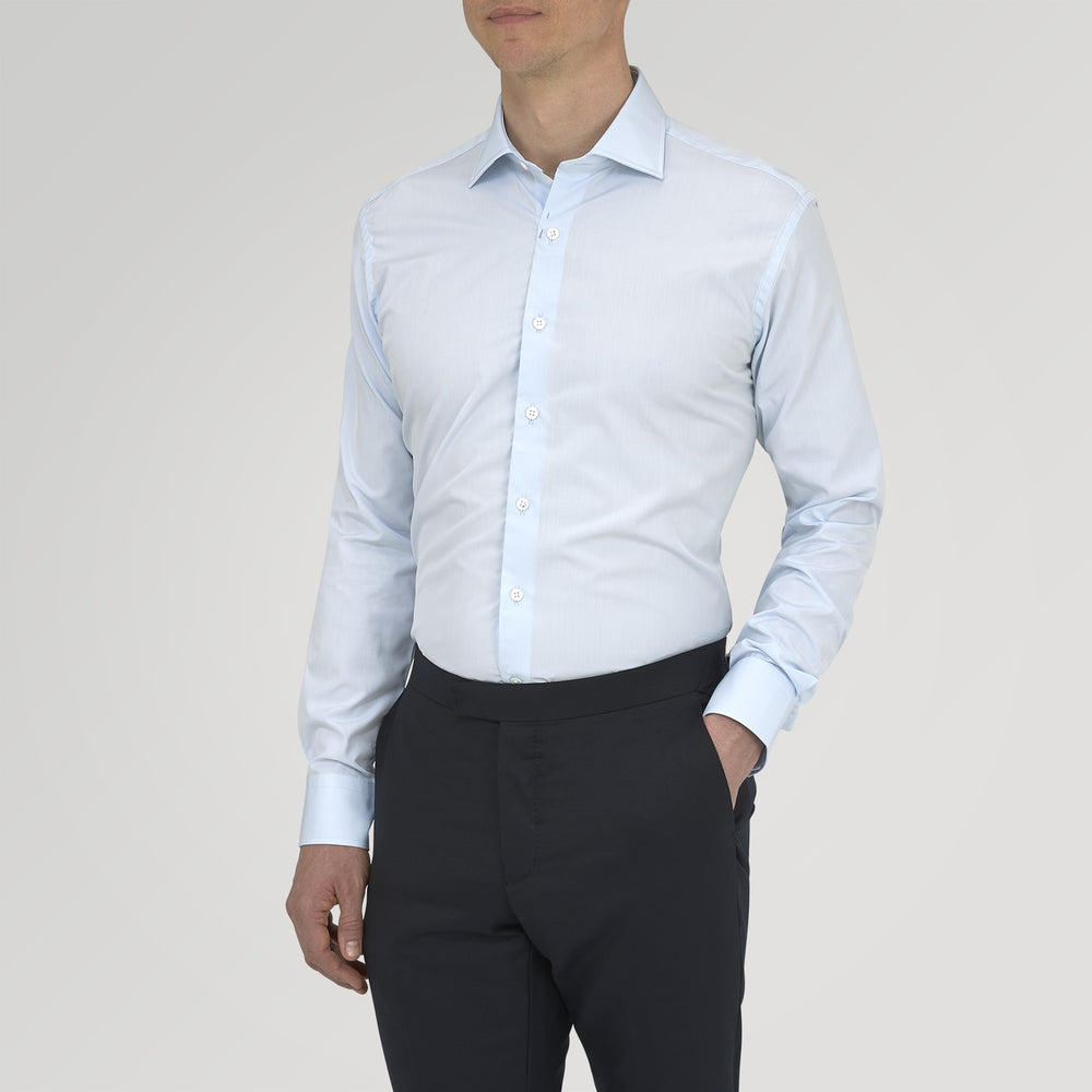 Turnbull & Asser's Tailored Fit Two-Fold 120 Light Blue Shirt features a classic Kent collar, white buttons, long sleeves with 2-button cuffs, and an inner collar label.