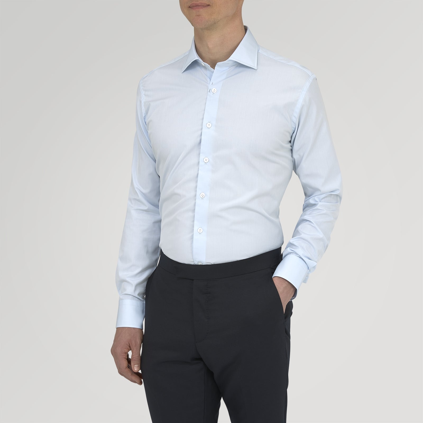 View 2 of product Turnbull & Asser's Tailored Fit Two-Fold 120 Light Blue Shirt features a classic Kent collar, white buttons, long sleeves with 2-button cuffs, and an inner collar label.